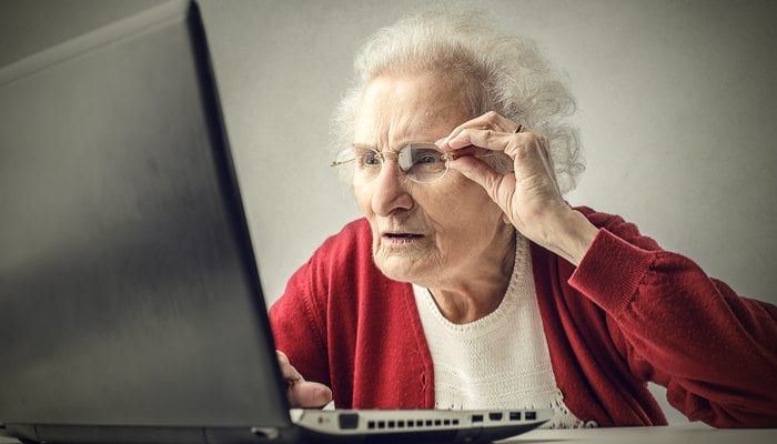 Older Patient Trying To Read Computer