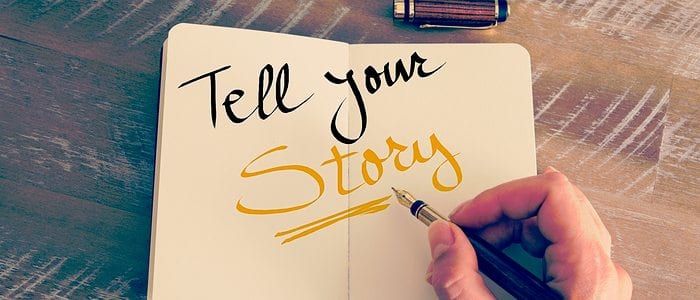 Hand Writing &Quot;Tell Your Story&Quot; In A Book