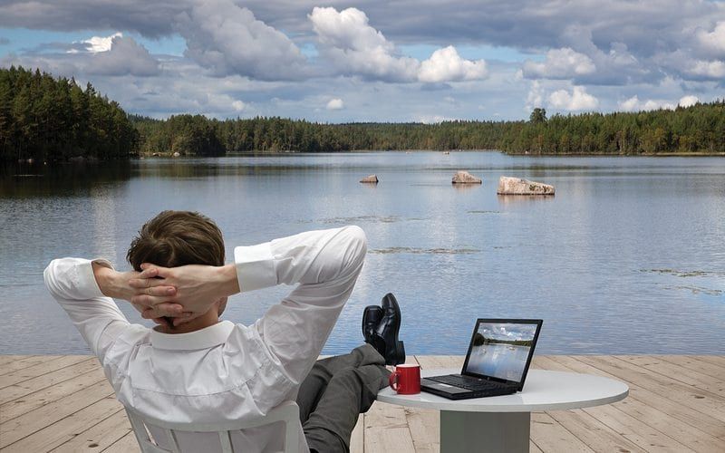 Businessman Relaxing By The Lake