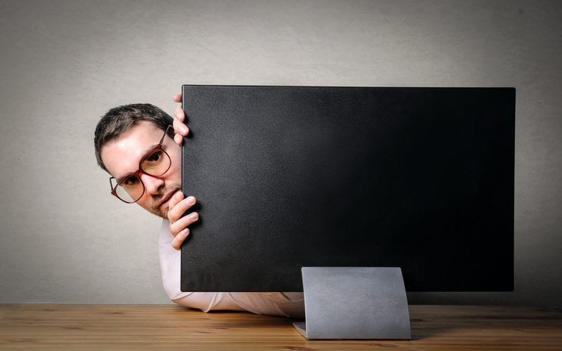 Man Hiding Behind Screen