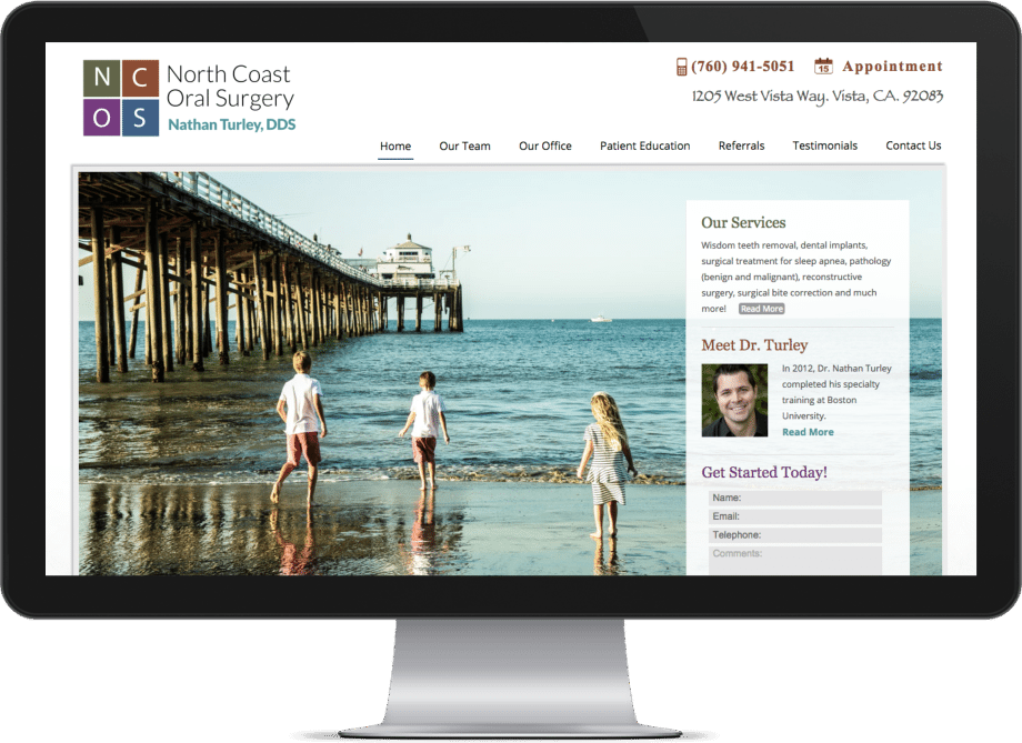 Screenshot of an oral surgeon website on a big monitor