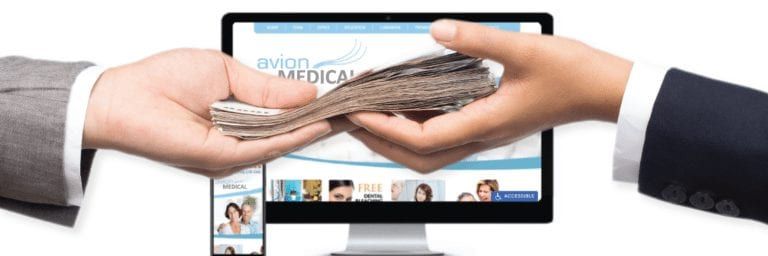 Hands exchanging money with a medical website on a monitor on the background