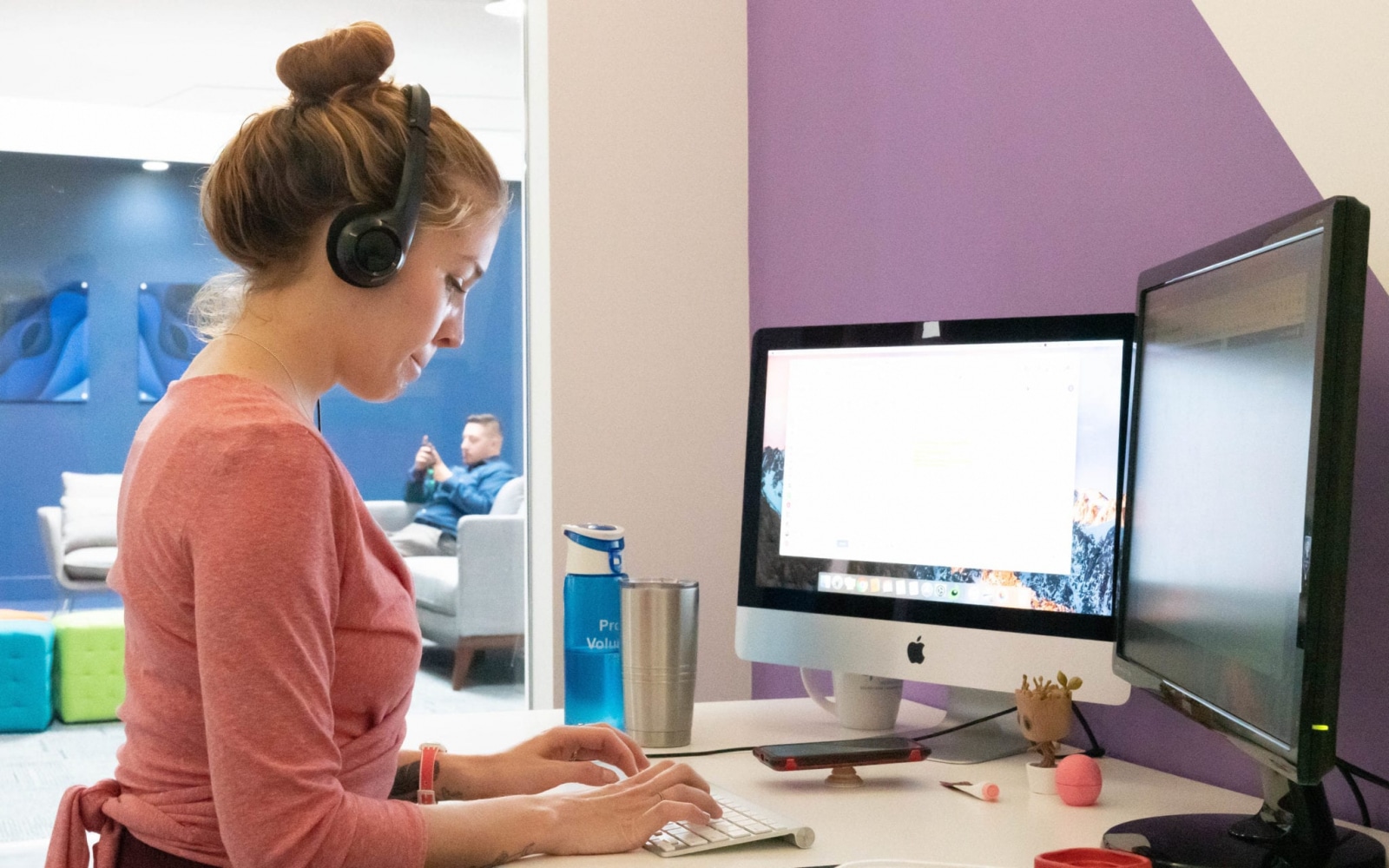 Christina D. Behind Her Desk Sending An Email Wearing A Headphone O360® Team Pictures