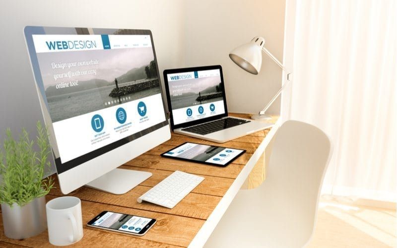 Responsive Websites Shown On Multiple Devices On A Desk