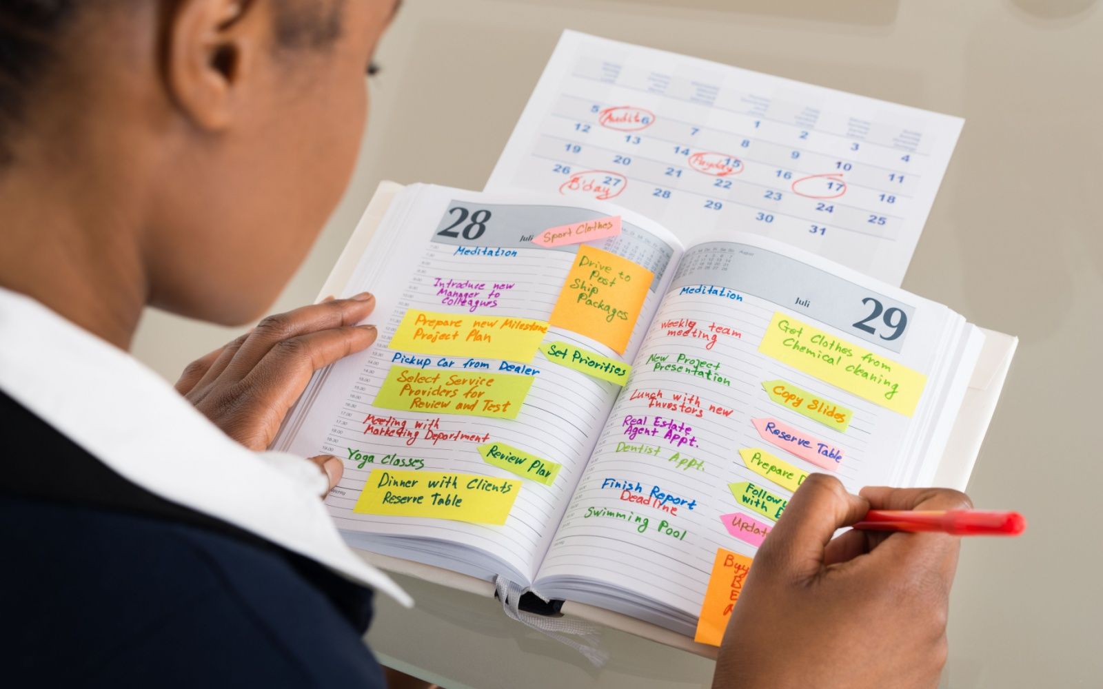 Employee Using Content Calendar For Organization